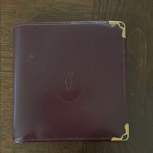 Authentic Cartier Elegant Burgundy Leather Wallet with Gold Accents